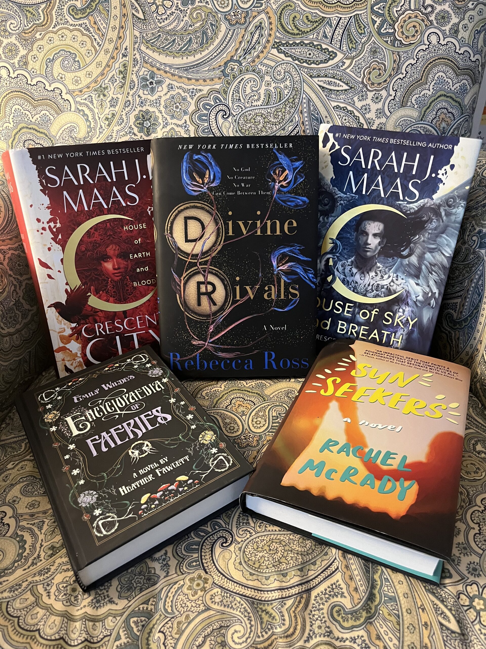 Physical books read in January: Crescent City 1 and 2, Divine Rivals, Emily Wilde's Encyclopaedia of Faeries, and Sun Seekers.
